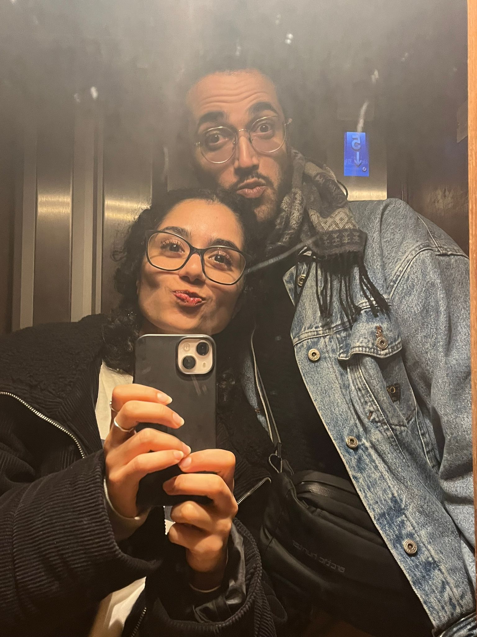 couple elevator selfie